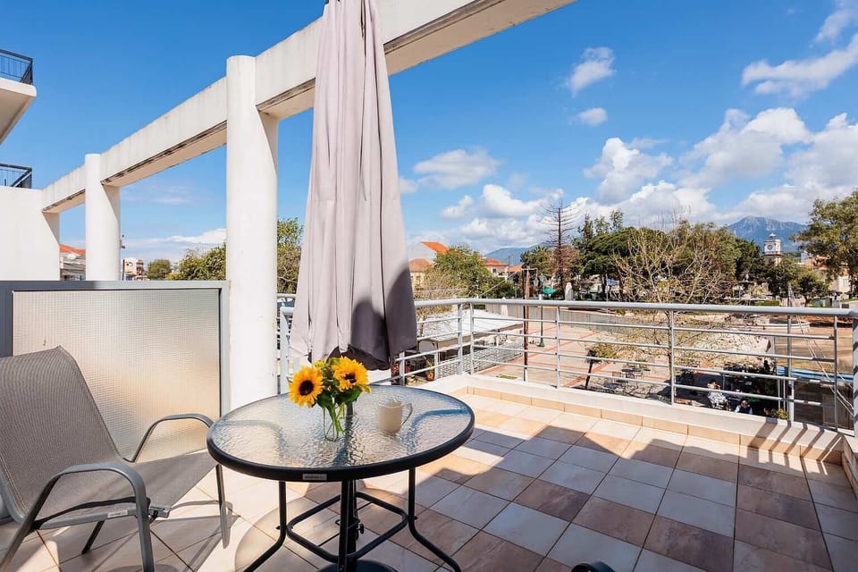 Panoramic City View from the Private Balcony with Café Table

