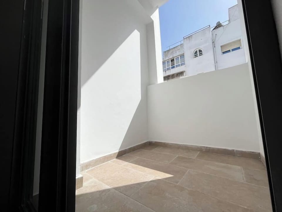 Step onto the balcony to bask in the natural light and enjoy a breath of fresh air.