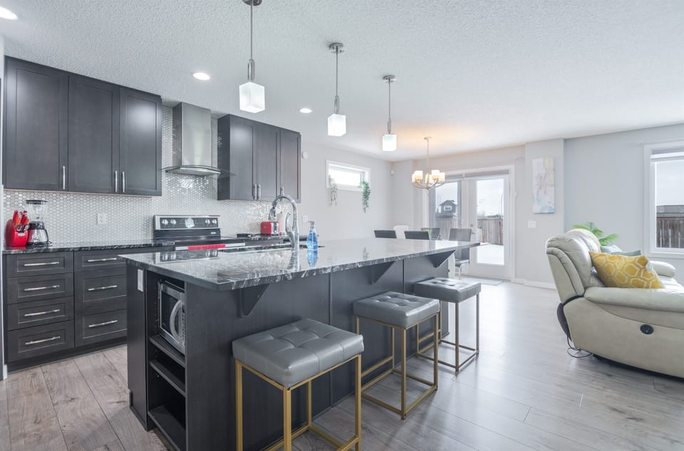 Fully equipped luxury kitchen with premium appliances and ample space for cooking and dining