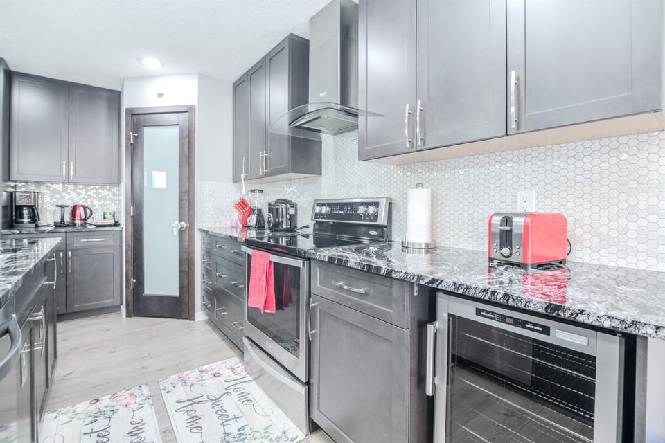 Fully equipped luxury kitchen with premium appliances and ample space for cooking and dining