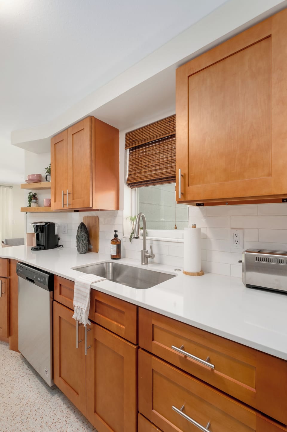 Kitchen features a Keurig Coffee Maker and French Press, and a deep basin sink
