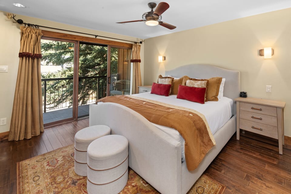 King Bed with sliding glass doors out to the balcony