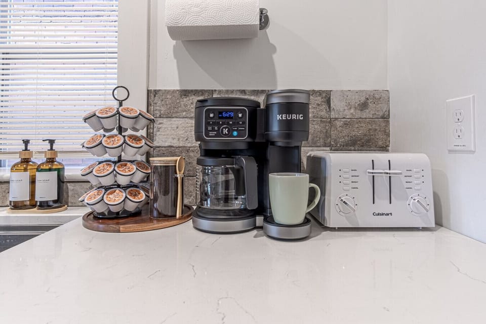 Indulge in the convenience of a Keurig coffee maker, stocked with premium coffee supplies for the perfect brew. Plus, a toaster is available for a fast and easy breakfast, making your mornings effortless and enjoyable.