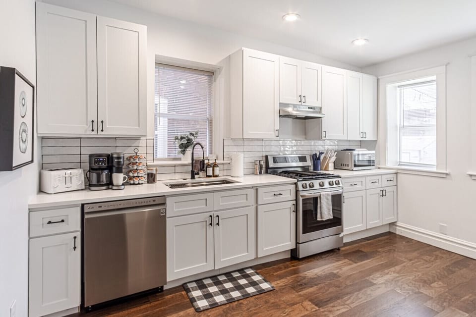 Whip up anything from quick snacks to gourmet meals in the fully equipped kitchen featuring a sleek stainless steel refrigerator and freezer, oven, stovetop, microwave, and essential small appliances like a Keurig coffee maker, toaster, and blender—alongs