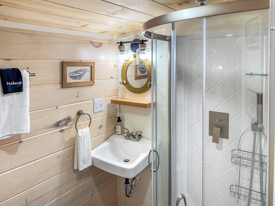is small but equipped! Brand new stand up shower, toilet and vanity.