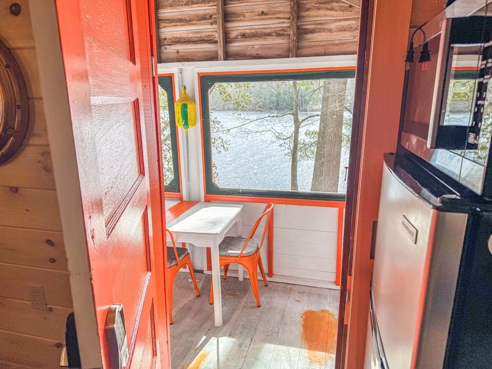 view from inside of the cabin to the indoor dining