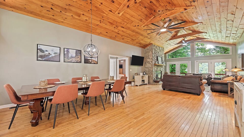 Spacious dining area with rustic vibes and forest views.