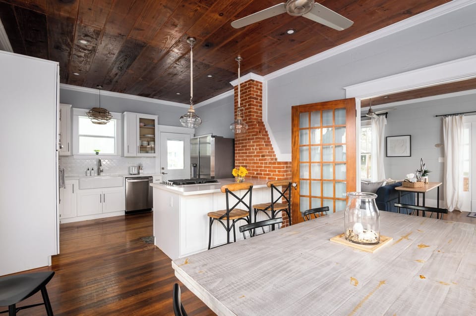Open-concept layout connects dining, living, and kitchen spaces