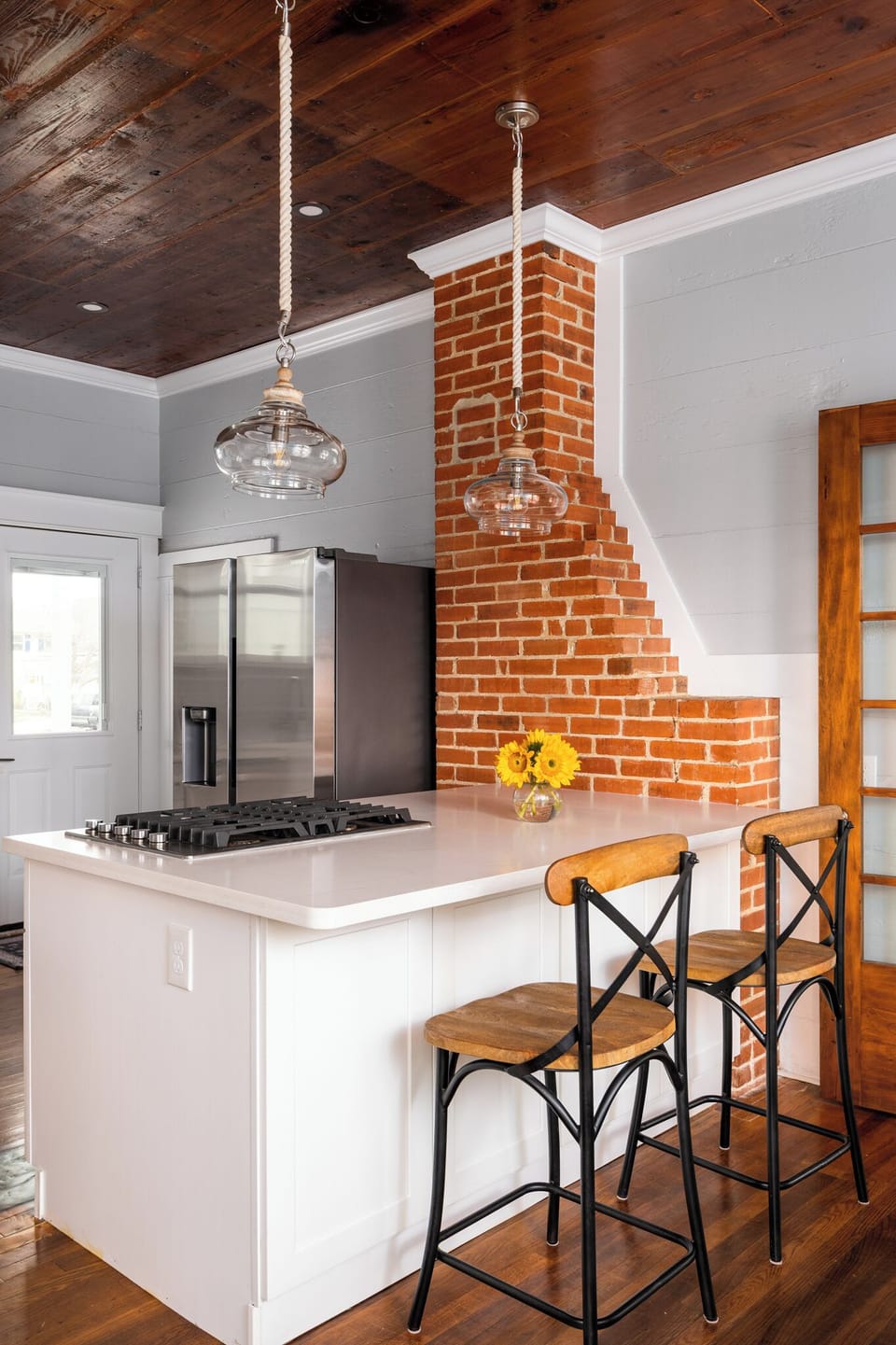 Gather around the kitchen island — perfect for morning coffee or casual meals