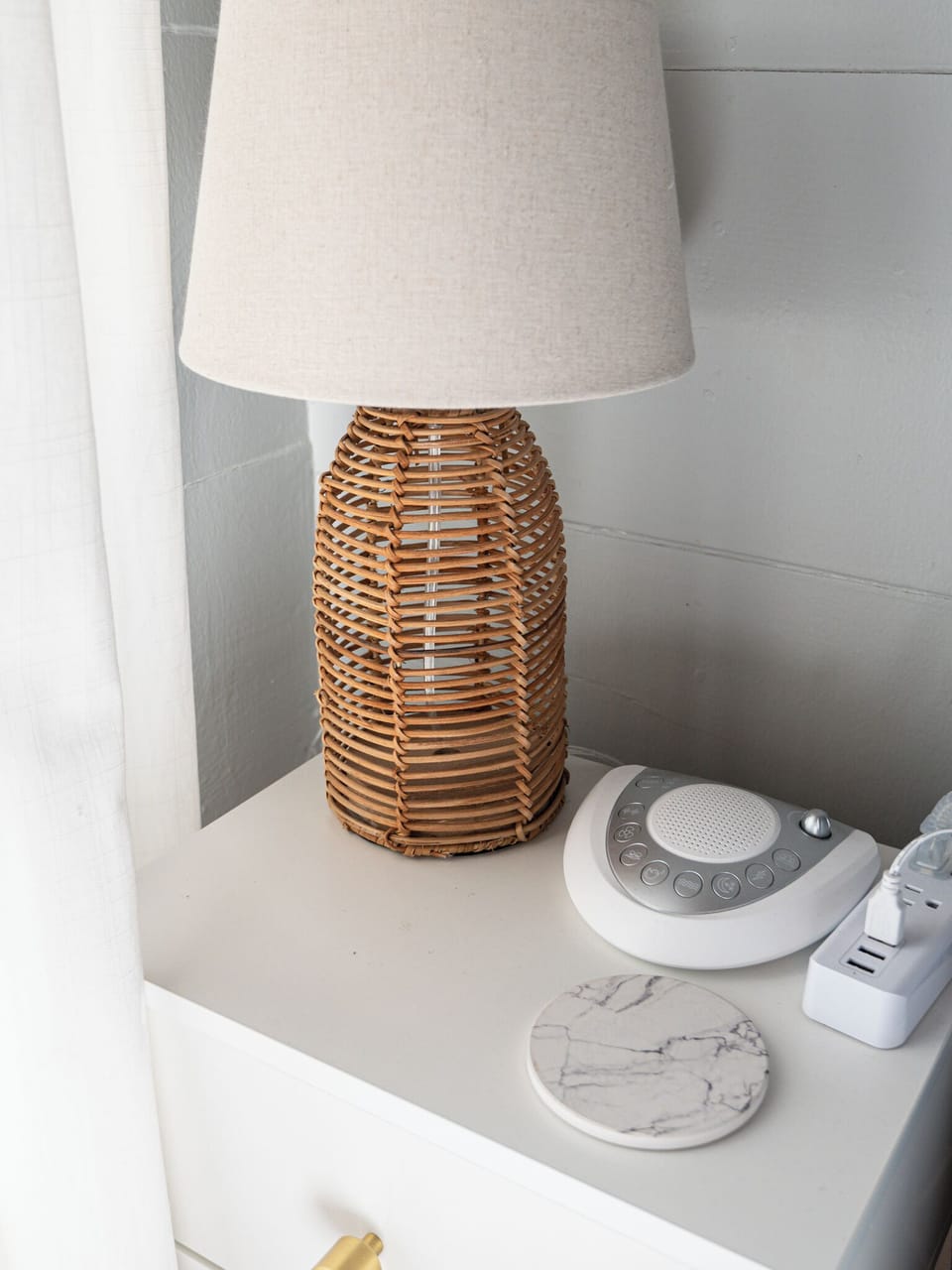 Thoughtful bedside touches including a sound machine and soft lighting