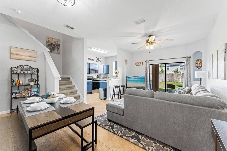 Spacious interior! The phot is showing the dining and living rooms downstairs overlooking the back patio.
