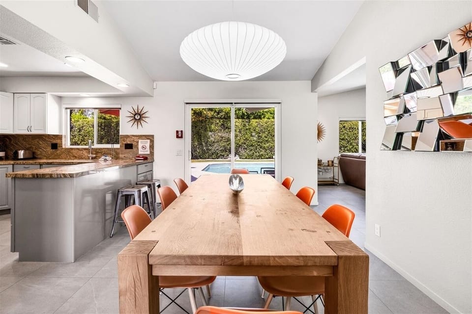 Share meals around the stylish, formal dining table that seats eight
