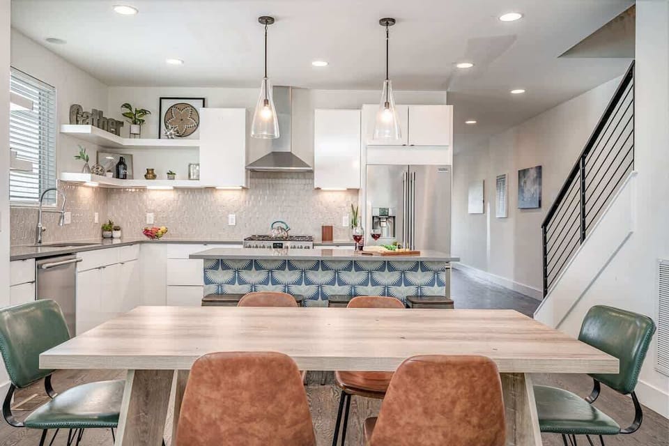 Spacious dining area with a table that comfortably seats six—perfect for meals, games, or gathering. (1st Floor)