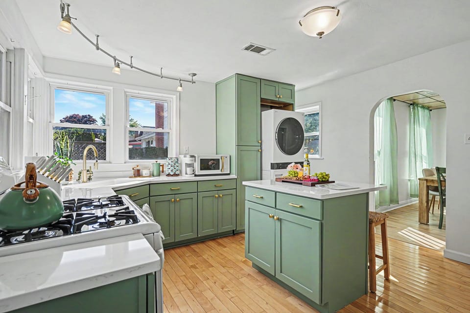 Island seating in kitchen with lots of countertop space