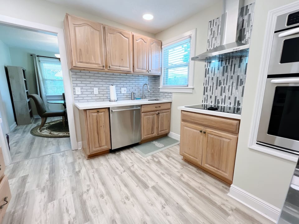 Fully stocked kitchen with full oven. stove, dishwasher, and refrigerator. 