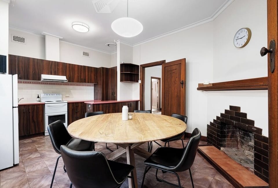 The dining area is adjacent to the kitchen.