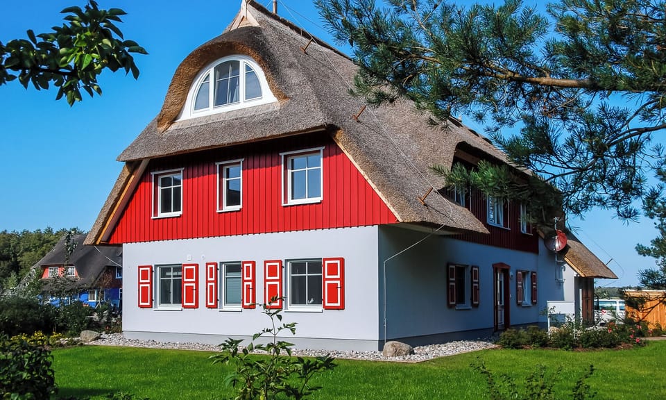 Exterior view of the holiday home with red facade