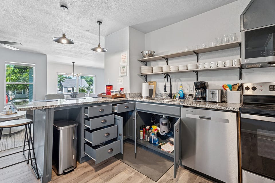 Peek into the cozy bedroom from the kitchen while prepping meals with ease.