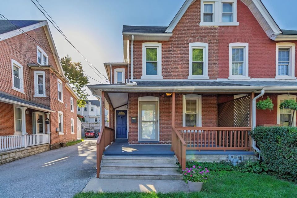 Front of house with large front porch shown.