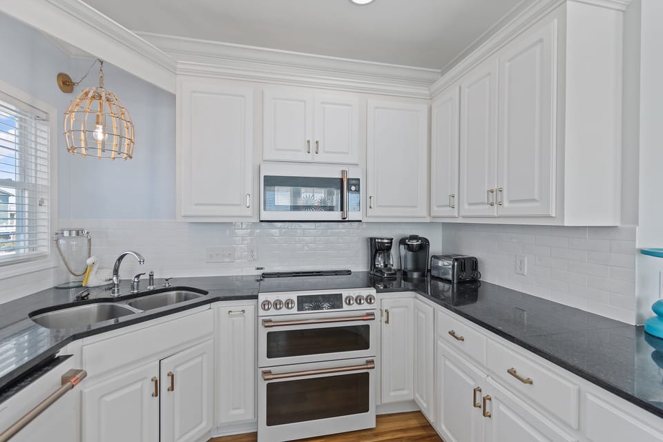 All new beautiful Cafe line GE Appliances and fully stocked kitchen.