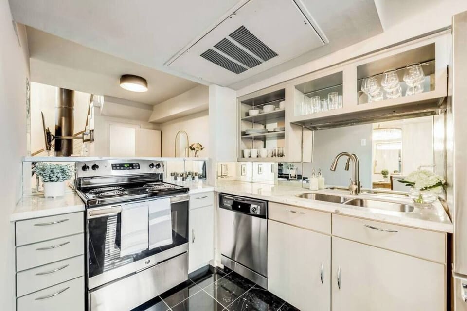 The kitchen is thoughtfully designed with high-end, contemporary appliances and is fully stocked to meet all your cooking and dining needs, making meal prep a breeze.