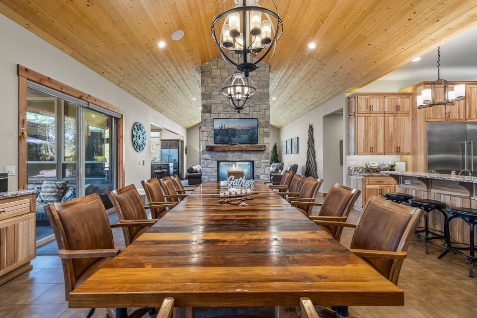 The dining room table offers 12 seats and is right next to the fireplace. 