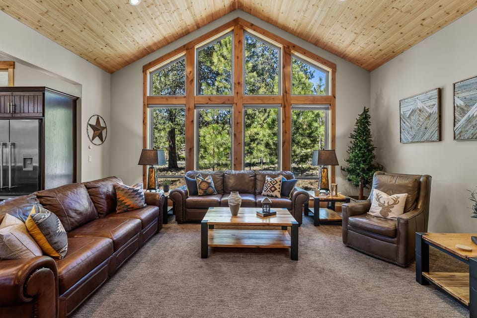 The large windows offer views of the trees.