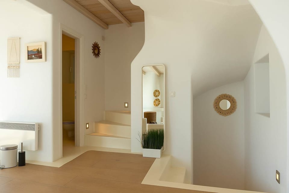 Elegant hallway leading to the bedroom suites
An open, breezy passageway flooded with natural light, connecting the villa’s key living areas in a seamless layout.
