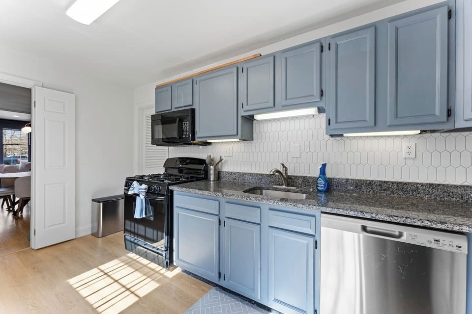 Bright, fully equipped kitchen with modern appliances—perfect for cooking meals at home during your stay