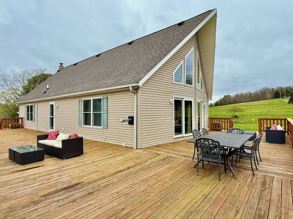 Outdoor dining table and cozy side sofa—perfect for enjoying meals and fresh air.