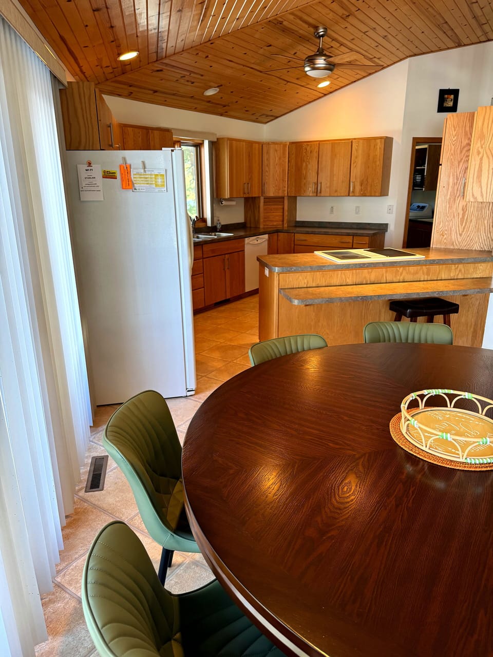 Dining conveniently located between kitchen and living rooms with lake views!