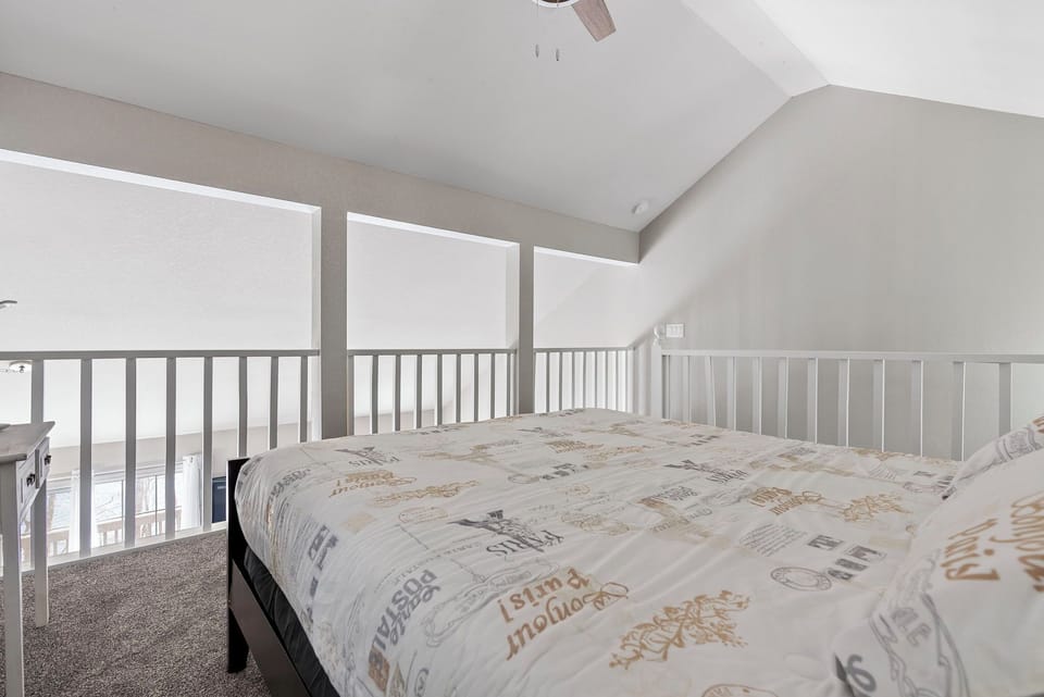 Experience cozy comfort in the second bedroom - complete with a plush queen bed and a TV for your entertainment needs.
