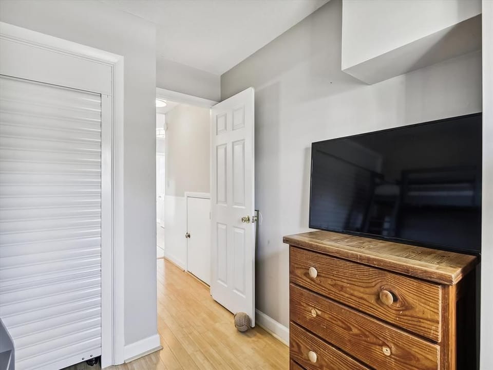 Hallway leading to cozy and well-appointed bedrooms.