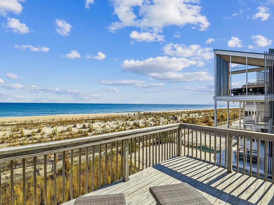 Breathtaking ocean views from the upper deck, just steps from the beach.
