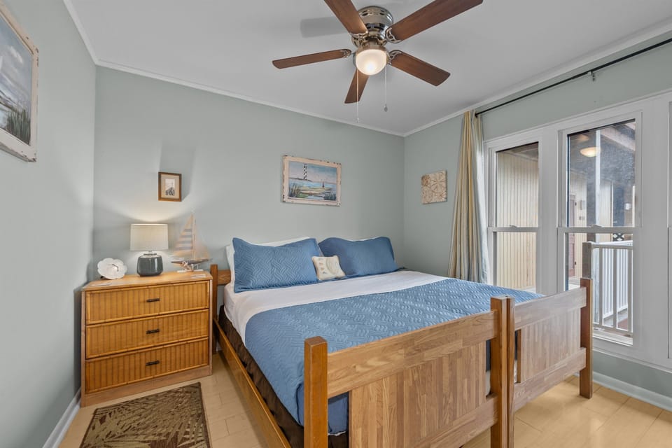 Front bedroom offers direct balcony access