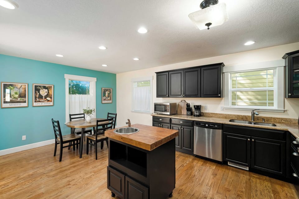 Fully equipped kitchen with modern appliances.