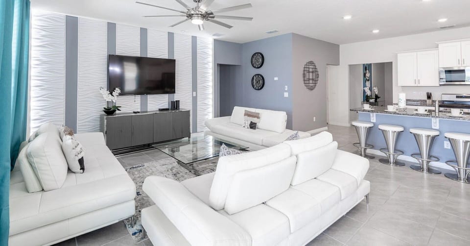 Living room showing sofa seating and TV