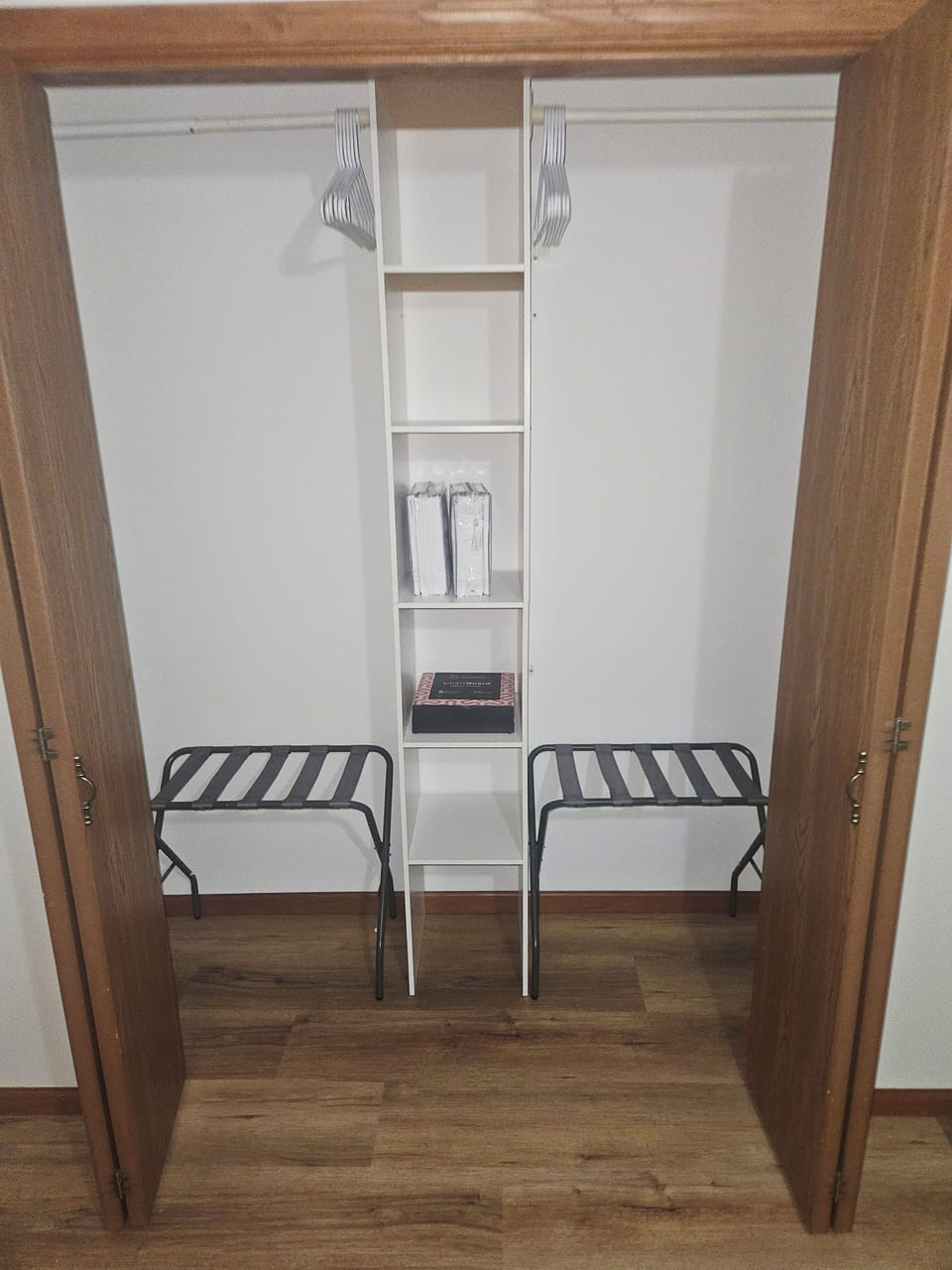 Room 3: closet with hangers and luggage racks