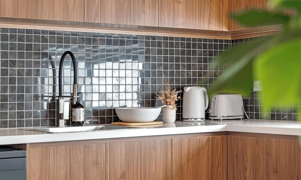 Clean kitchen area with convenient appliances