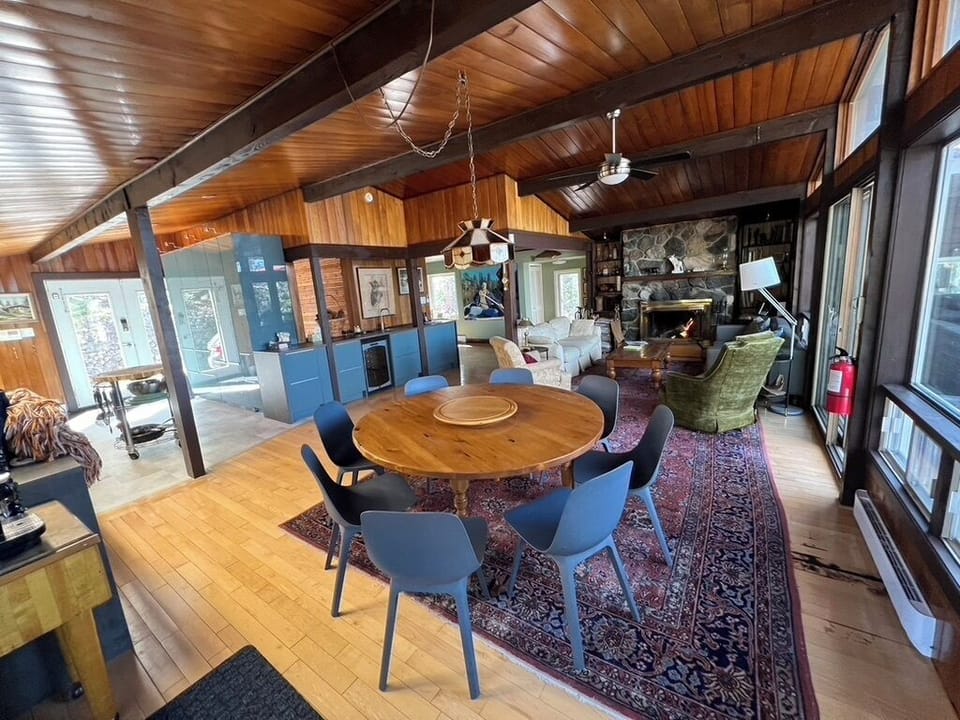Open concept kitchen, dinning and living rooms with cathedral ceilings