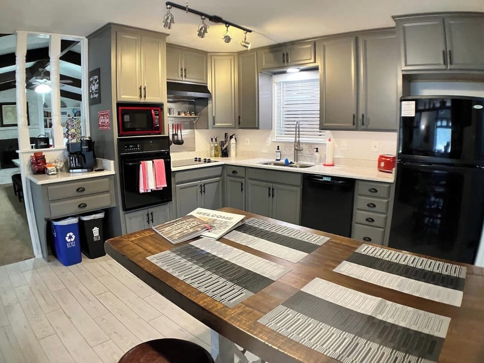 Brand new kitchen with quartz countertops, new sink and commercial style faucet.