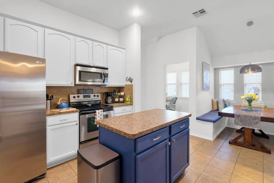 Fully stocked kitchen with pots, kitchen necessities, cooking spices, coffee bar and more. 