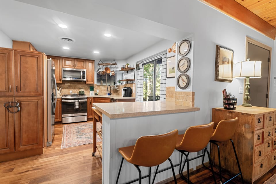 Kitchen and bar with high top chairs
