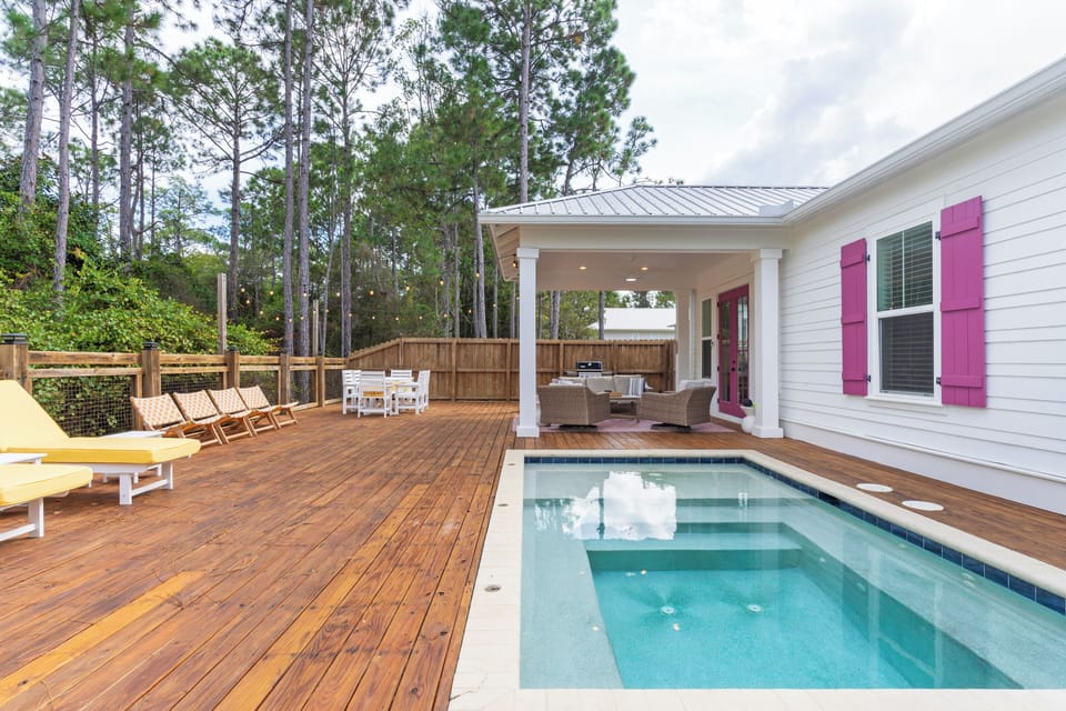 Dive into relaxation with a sparkling plunge pool, sun-drenched deck, and shaded outdoor living