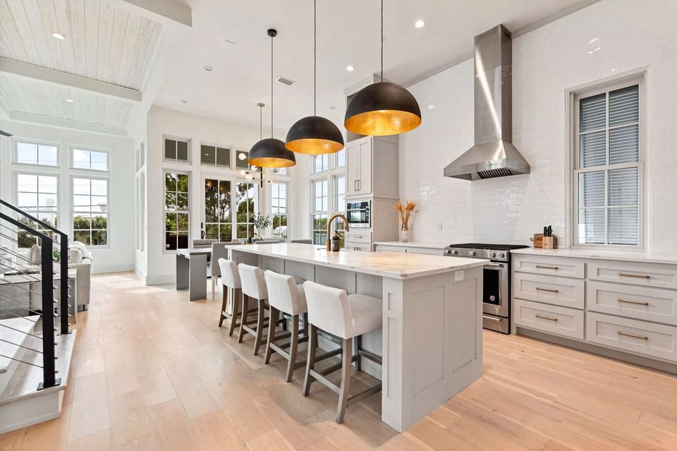 Cook and connect in a modern kitchen featuring flexible seating arrangements for every occasion!