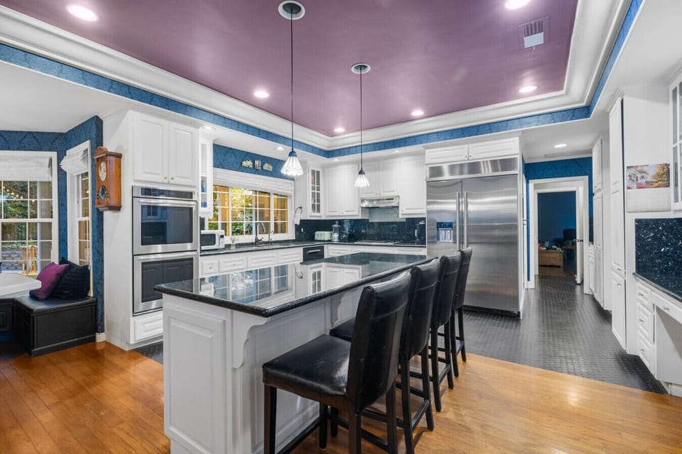 Whip up delicious meals in this bright chef’s kitchen with oven and a massive island for gathering.