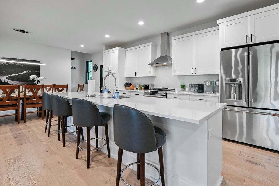 Sleek kitchen island w/ seating, ideal for casual bites and conversation