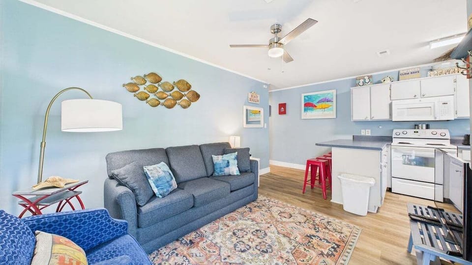 Open concept living area with stylish furnishings