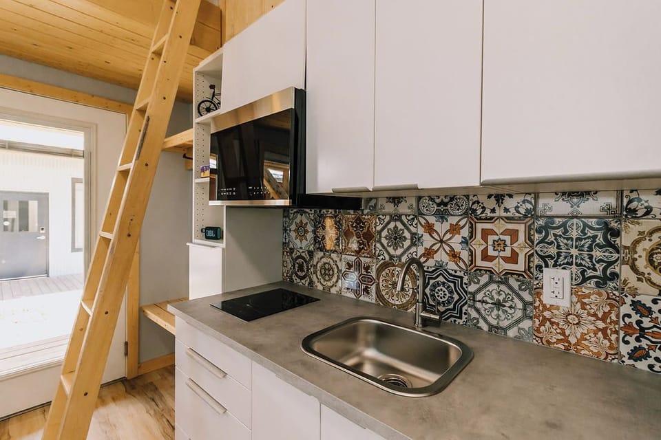 Kitchen - microwave, induction stove top, sink, mini fridge