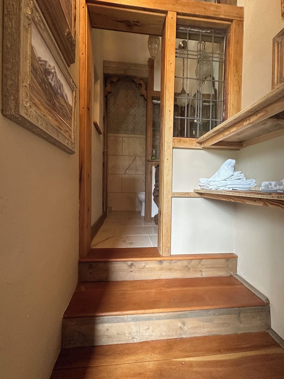 Stairs leading to the bathroom on the top floor